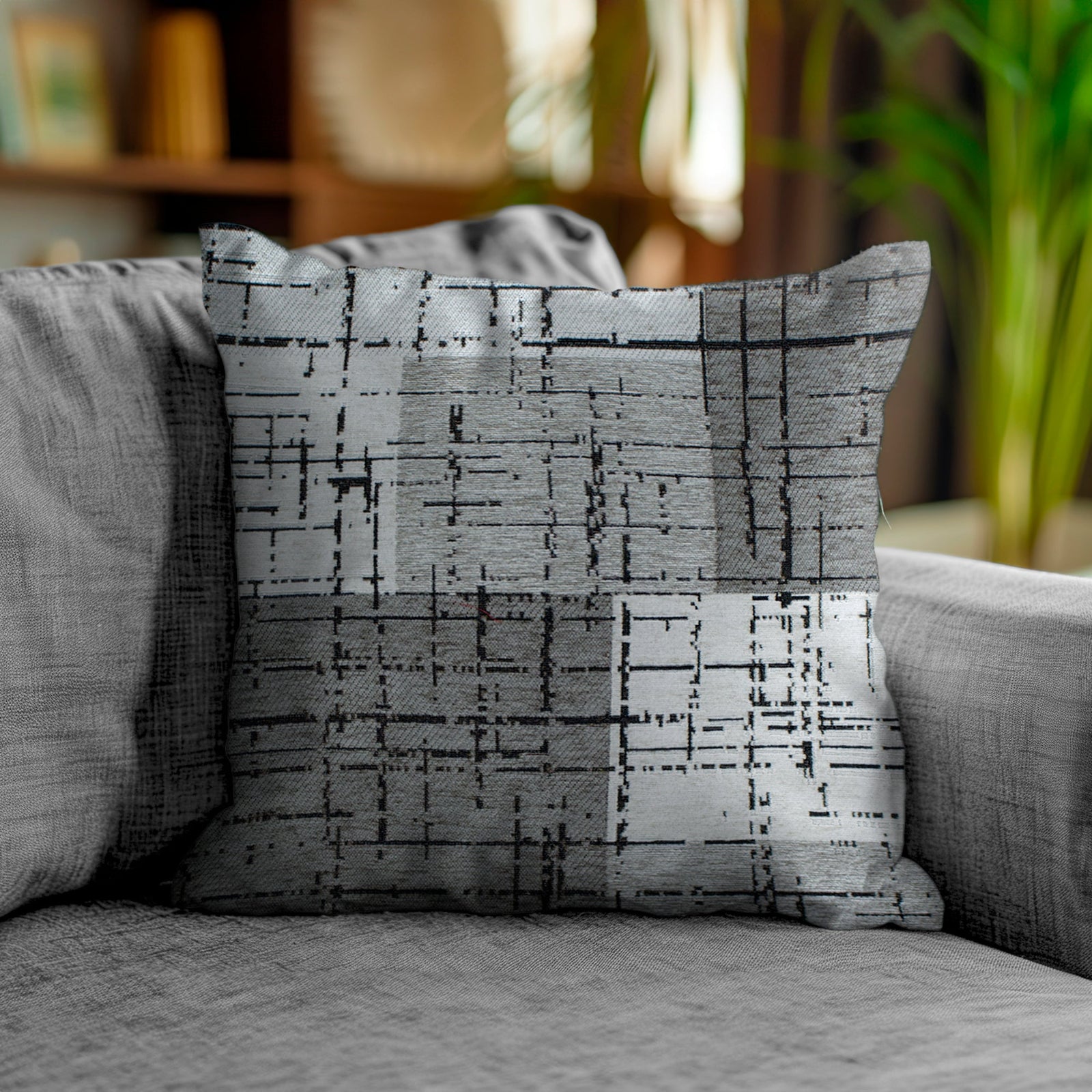 Decorative Jacquard cushion in warm grey on a sofa, 50x50 cm, perfect for modern or classic interiors.