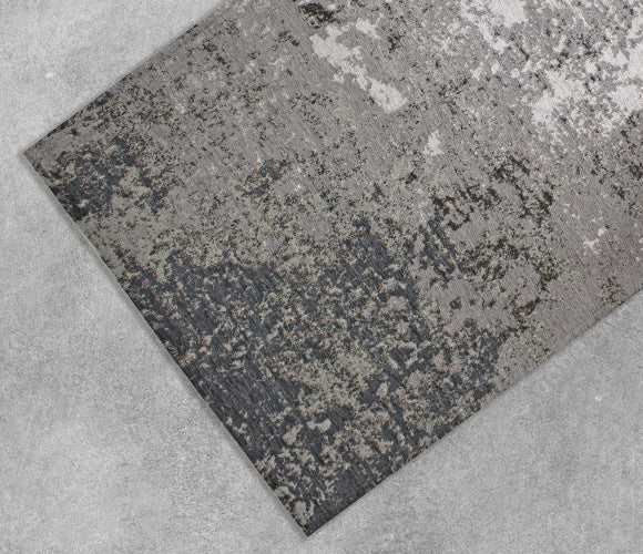 Tappeto arredo dis.BETA colore antracite 200x300 cm con texture simile al cemento, ideale per interni moderni.