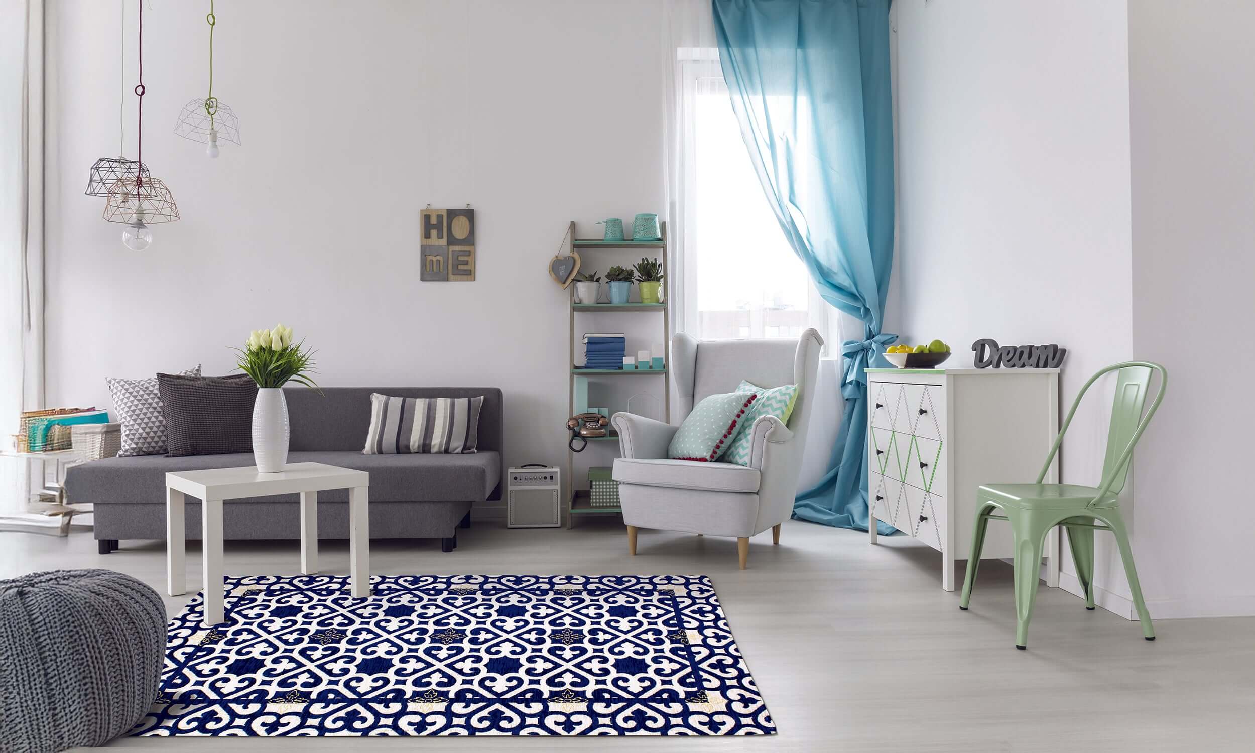 Modern living room with blue patterned rug, cozy furniture, and bright decor accents.