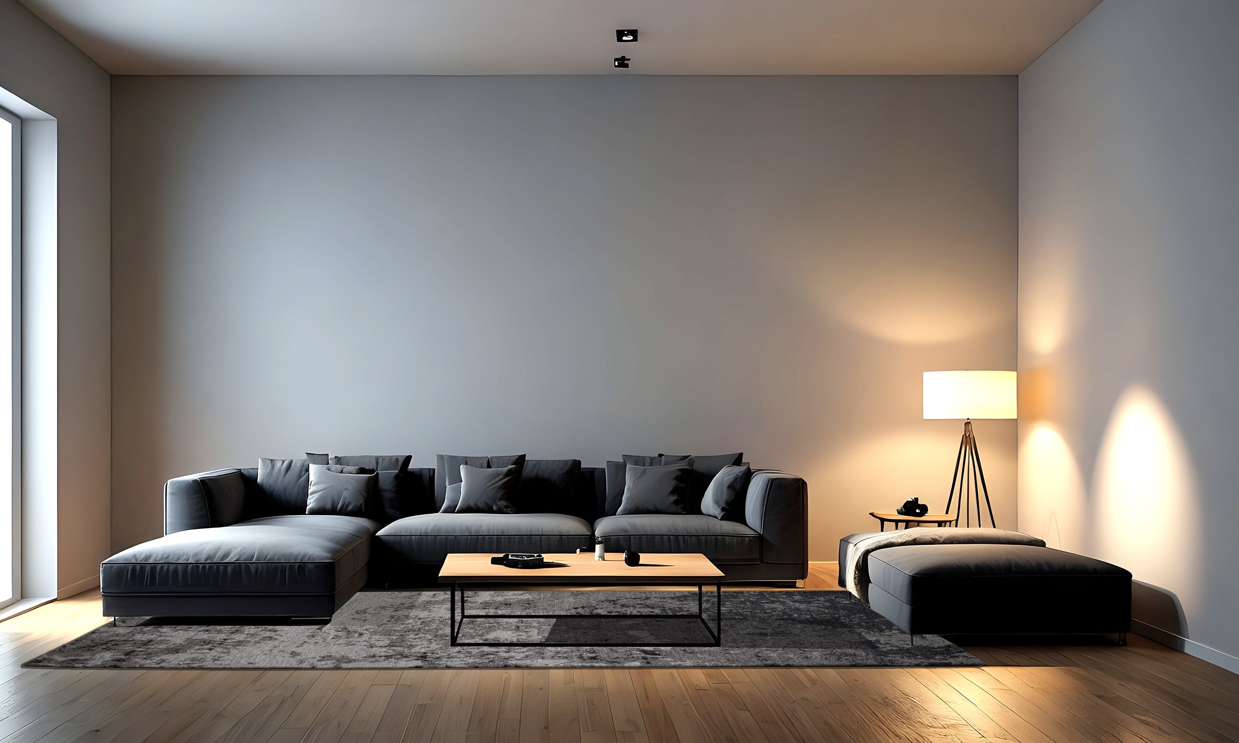 Contemporary living room featuring a stylish gray sectional sofa, wooden floor, and modern lamp.