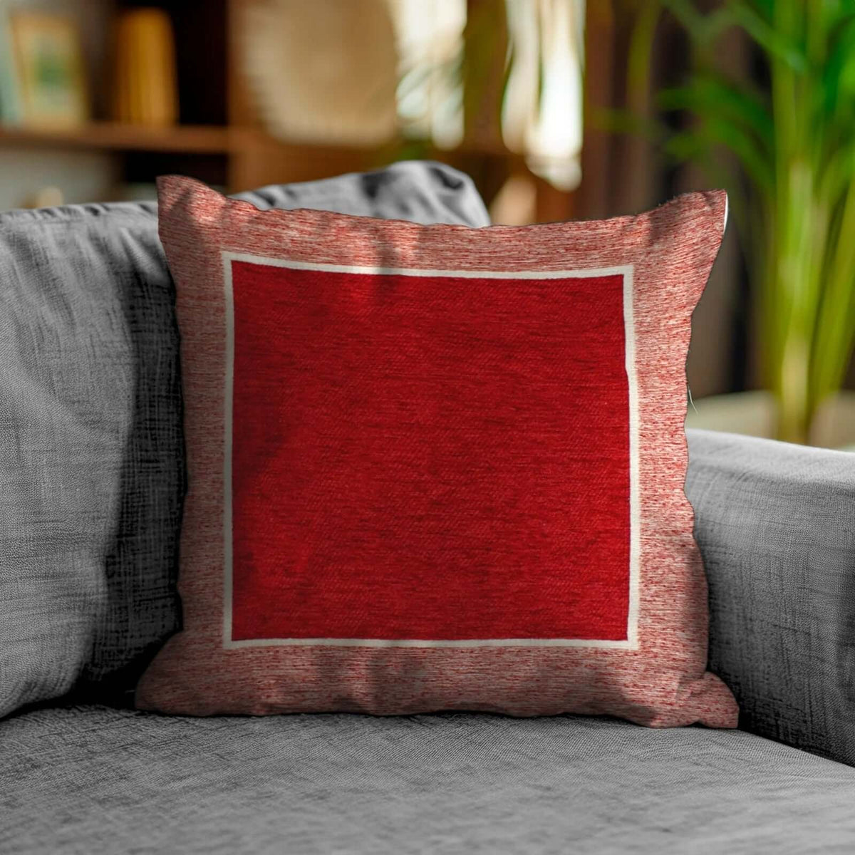Coppia cuscini arredamento jacquard sfoderabili Roma su divano moderno, colore rosso con dettagli bianchi.