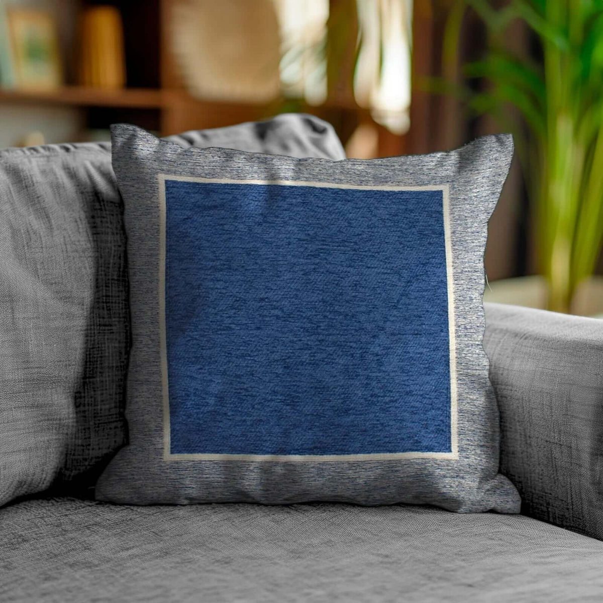 COPPIA CUSCINI ARREDO JACQUARD SFODERABILI ROMA, cuscino decorativo blu su divano grigio.