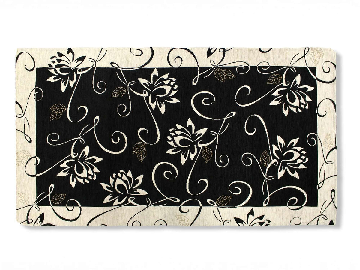 TAPPETO ARREDO DIS.NINFEA CON ANTISCIVOLO con design floreale su sfondo nero e bianco.
