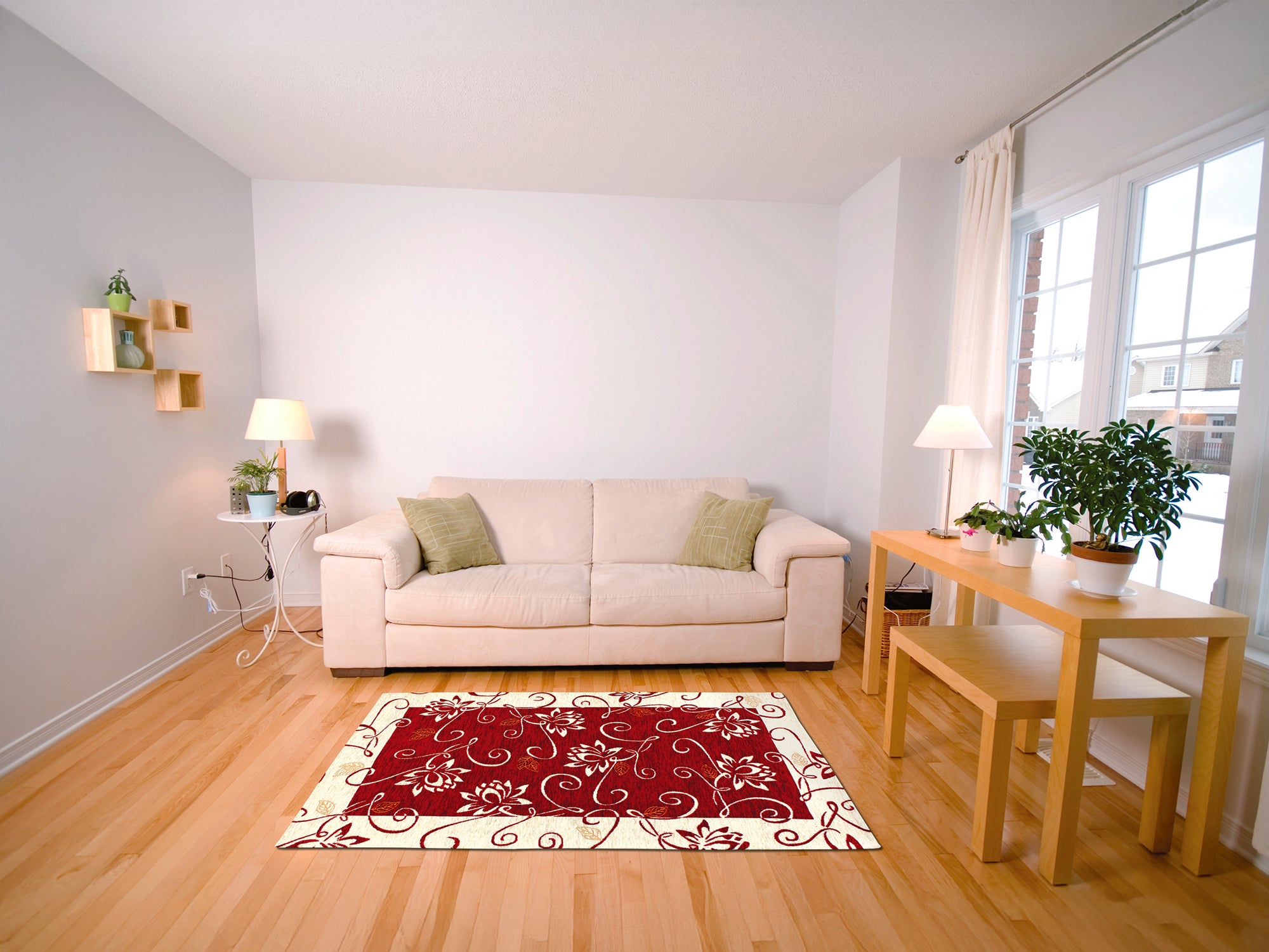 Red floral area rug in a modern living room with beige sofa and wooden table.