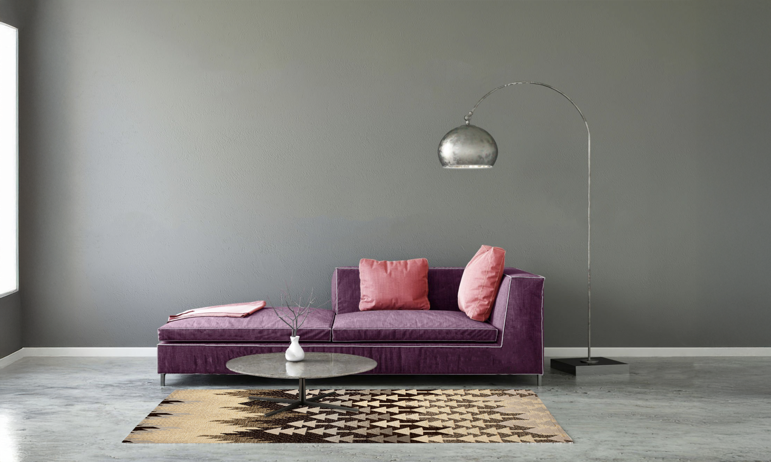 Modern living room featuring a purple sofa, pink cushions, and a stylish geometric rug.