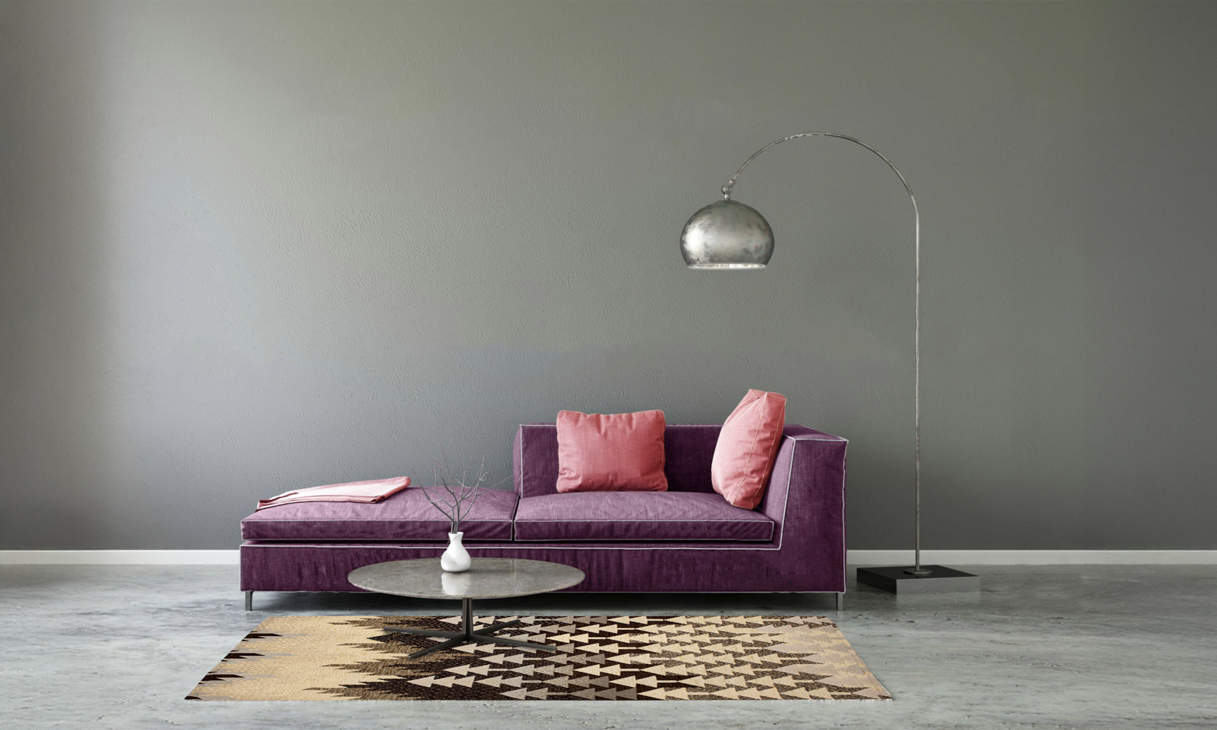 Modern living room with purple sofa, pink cushions, and stylish floor lamp over a decorative rug.