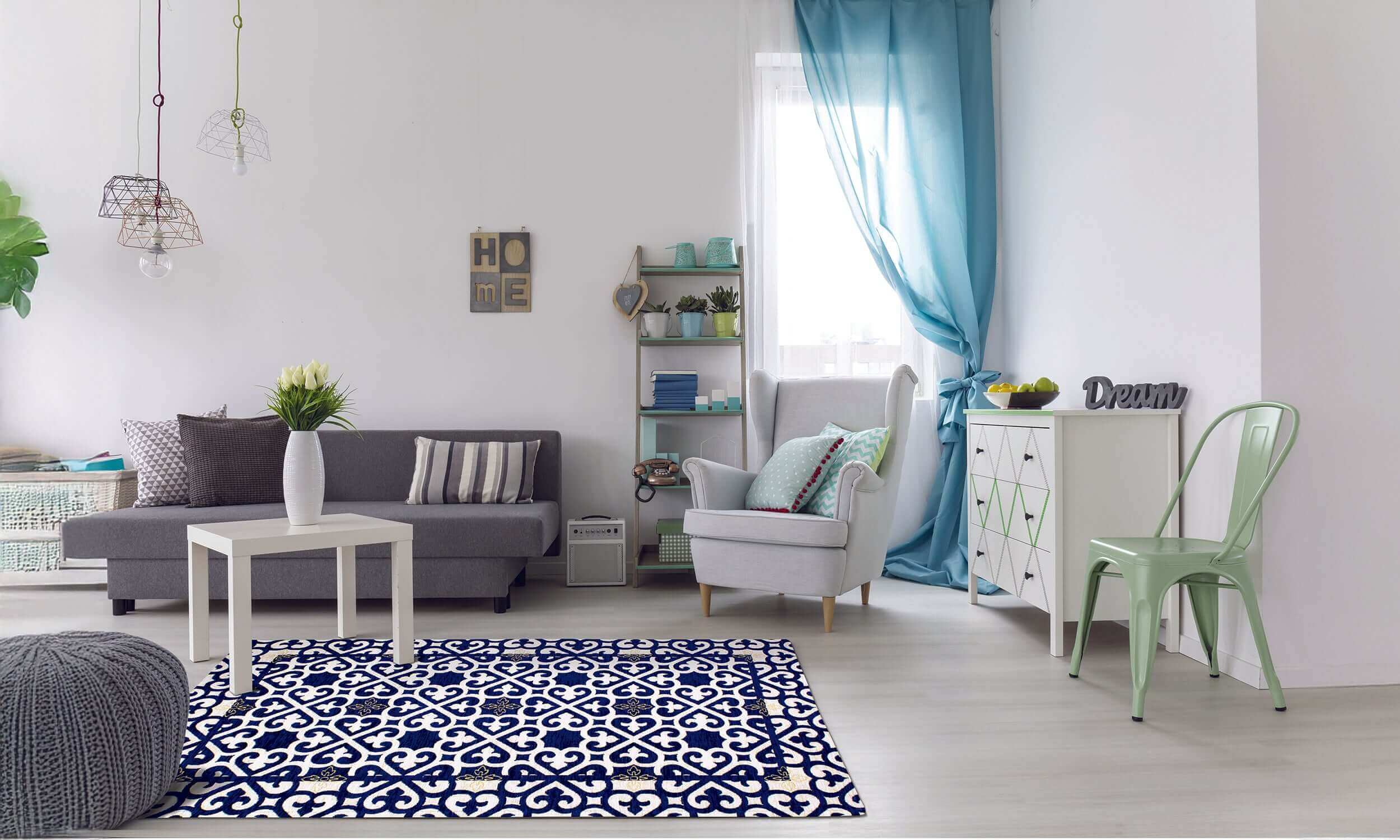 Spacious living room featuring a stylish blue and white rug with geometric pattern, cozy furniture, and natural light.