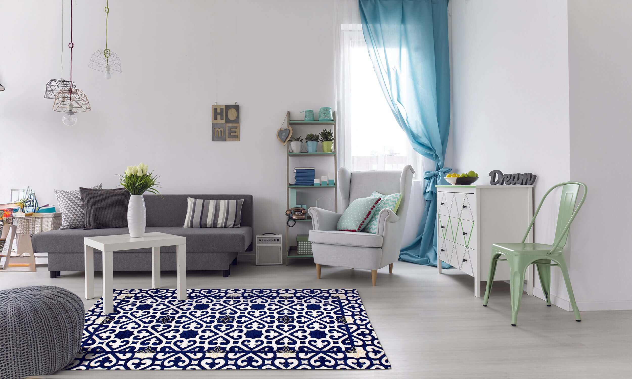 Modern living room with a decorative blue patterned rug, cozy furniture, and stylish decor.