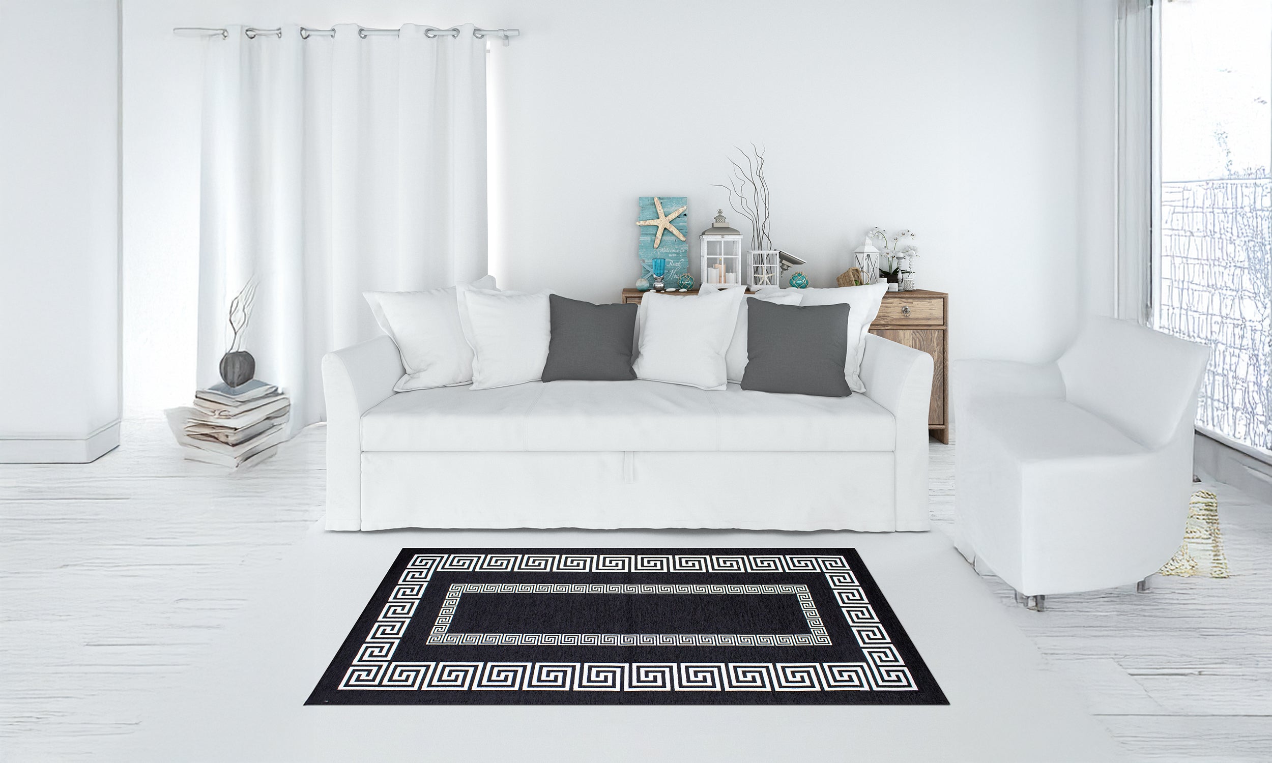 Modern black and white area rug Tappeto Atene in stylish living room with white furniture.