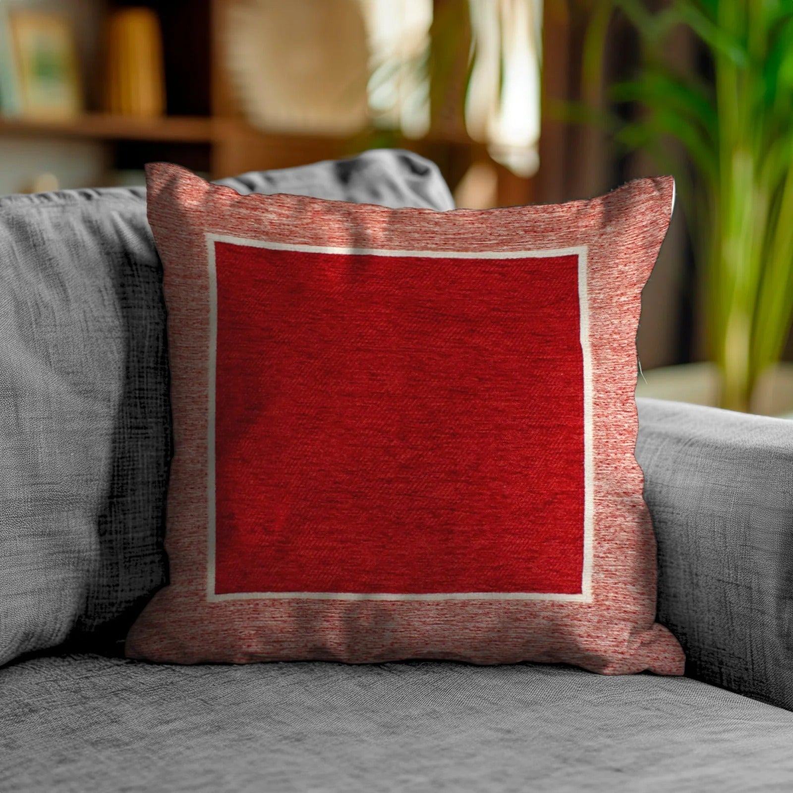 Coppia cuscini arredamento jacquard sfoderabili Roma su divano moderno, colore rosso con dettagli bianchi.