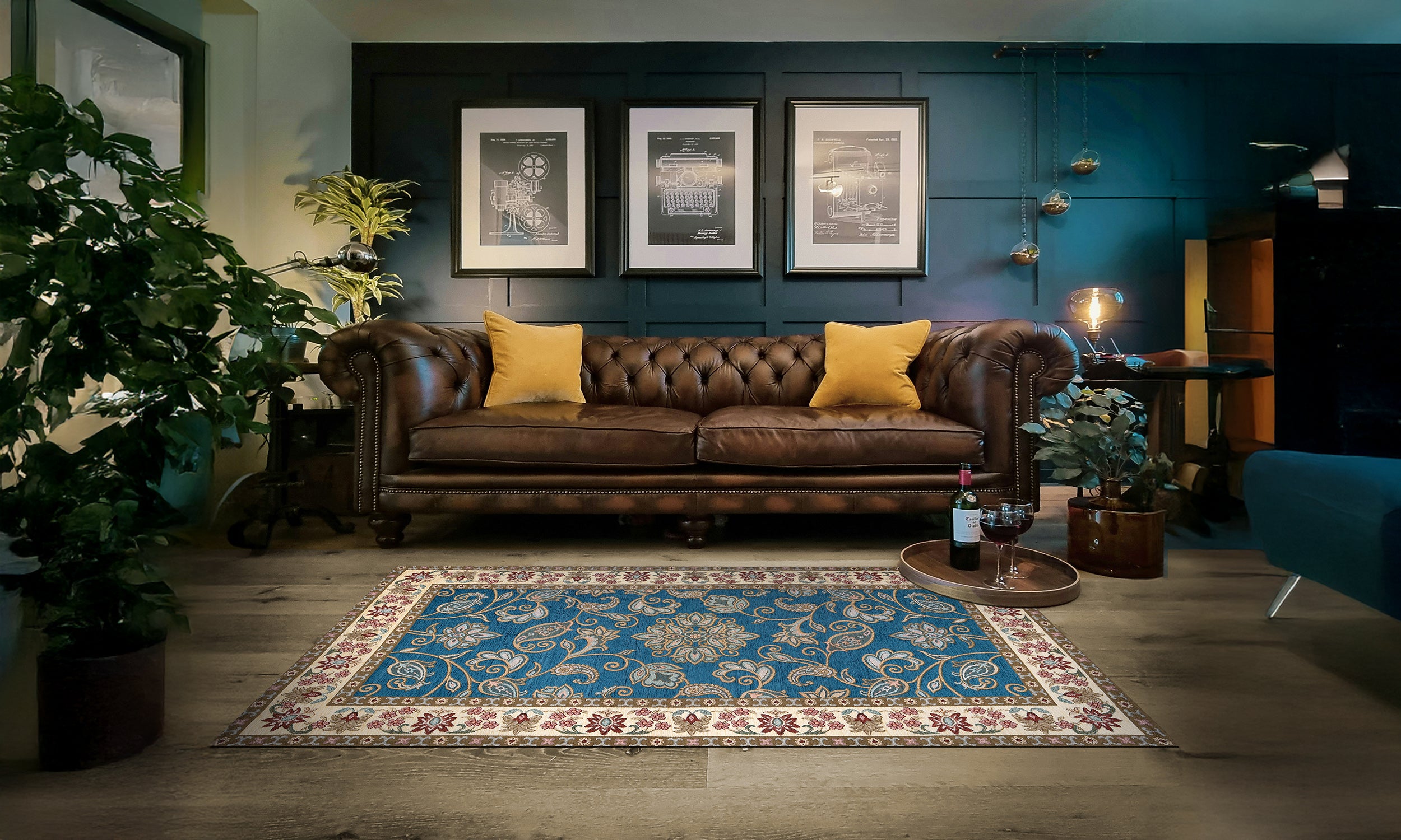 Modern blue area rug with intricate patterns, placed in a stylish living room with leather sofa and plants.