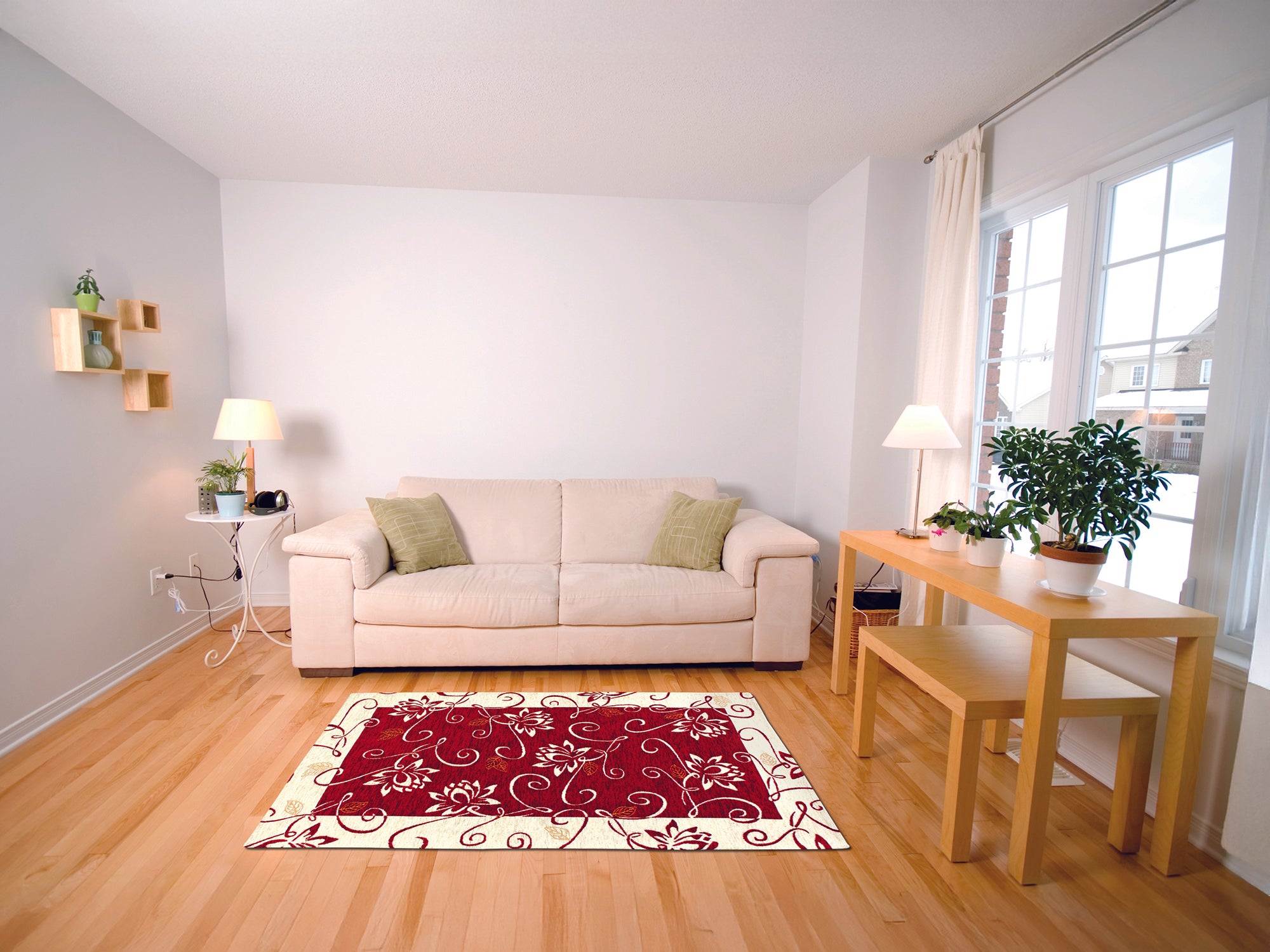 Modern living room featuring a red patterned area rug, beige couch, and wooden dining table in a bright setting.