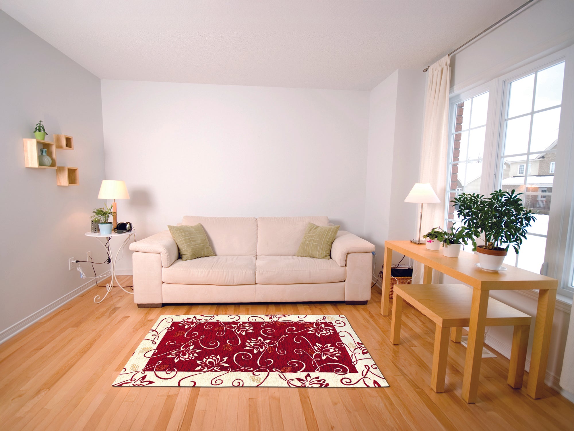 Modern red and cream floral rug in cozy living room with beige sofa and wooden table.