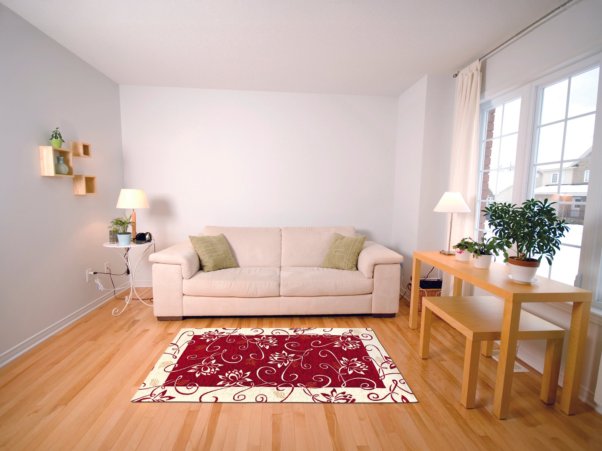 Red floral area rug in a modern living room with beige sofa and wooden table.