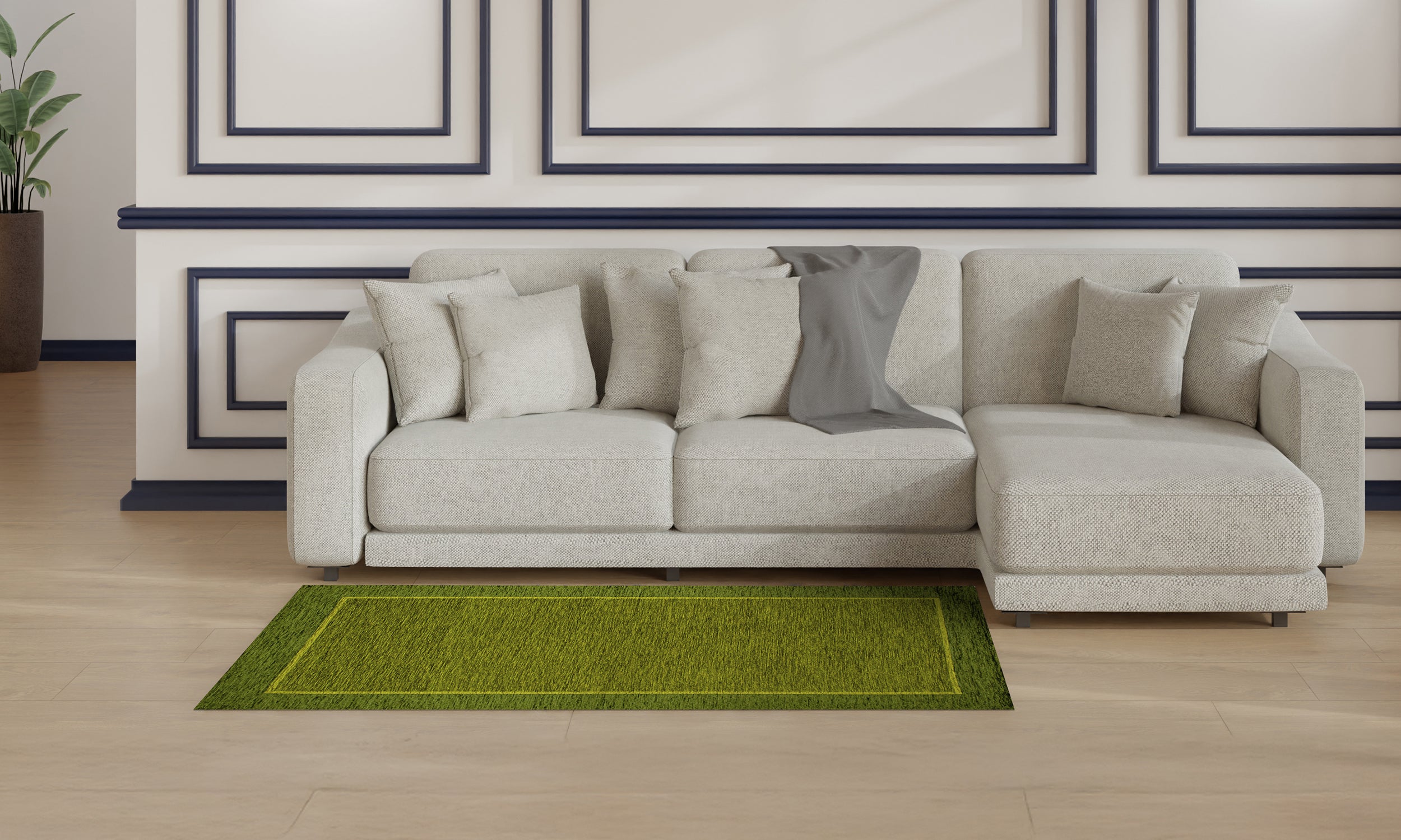 Tappeto verde giungla 115x175 cm con antiscivolo, posizionato davanti a un divano moderno in un salotto elegante.