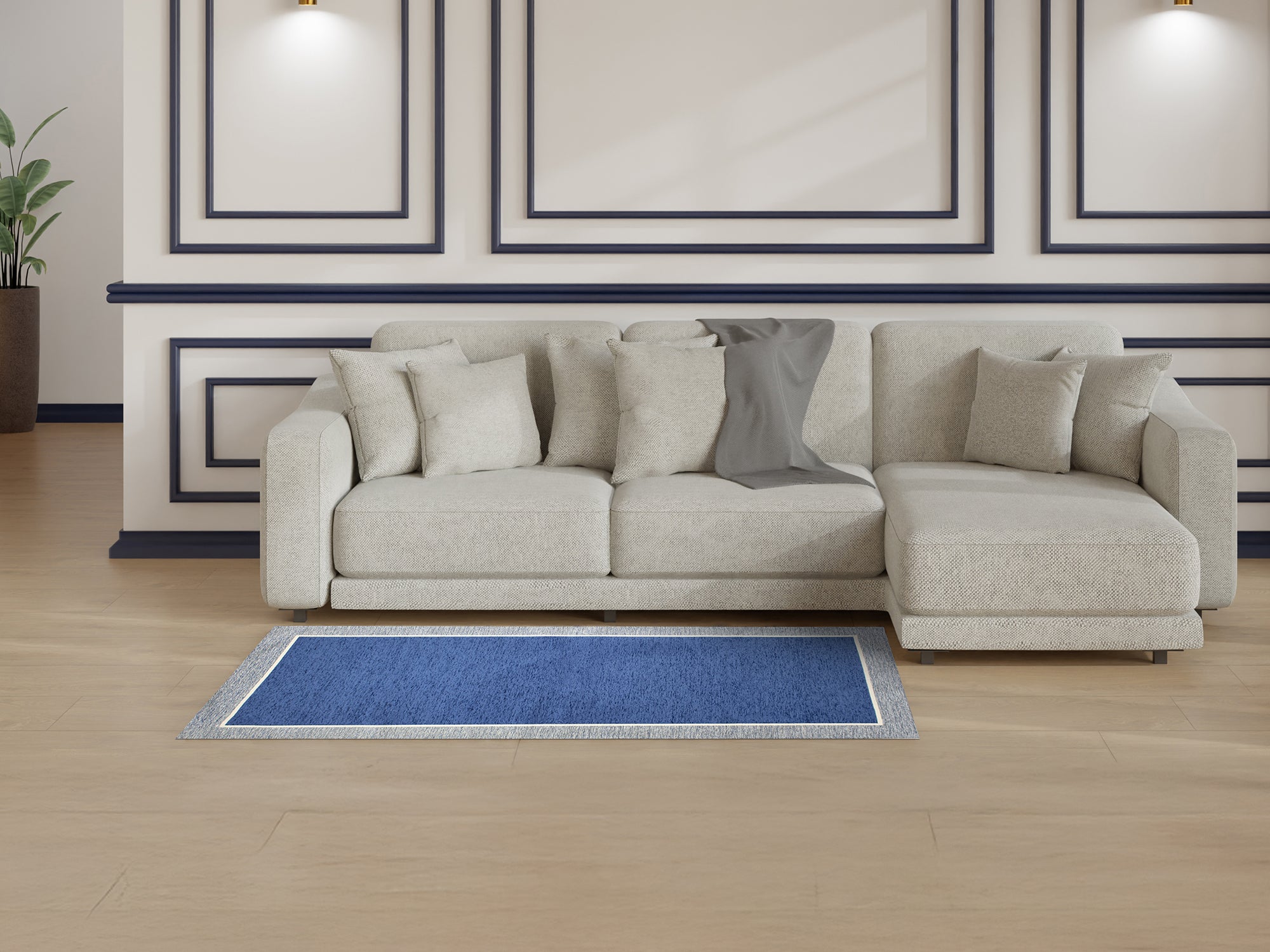 Modern blue rug in a cozy living room featuring a light gray sectional sofa and stylish decor.