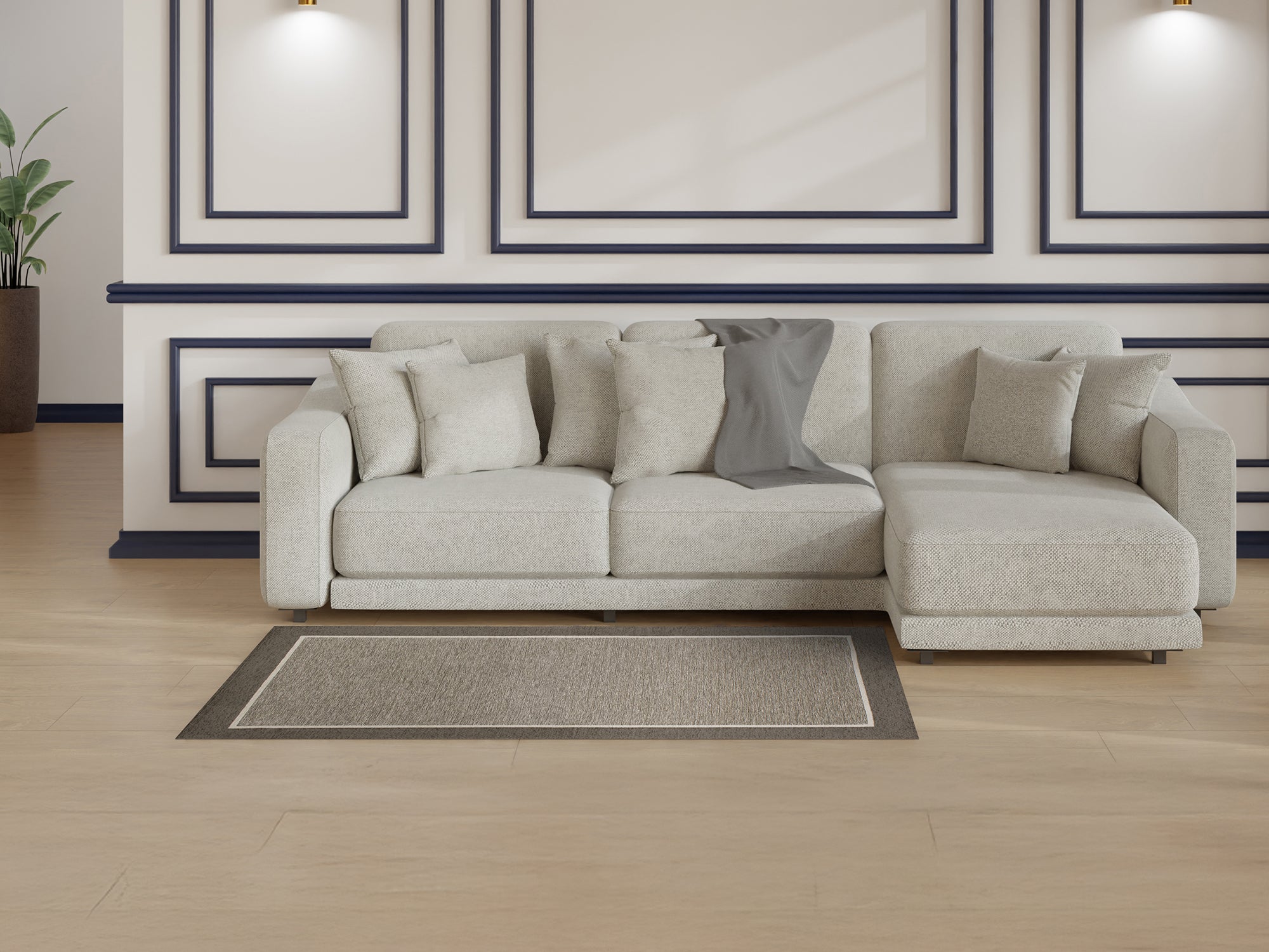 Modern grey carpet on light wood floor under a cozy living room sofa with decorative pillows.