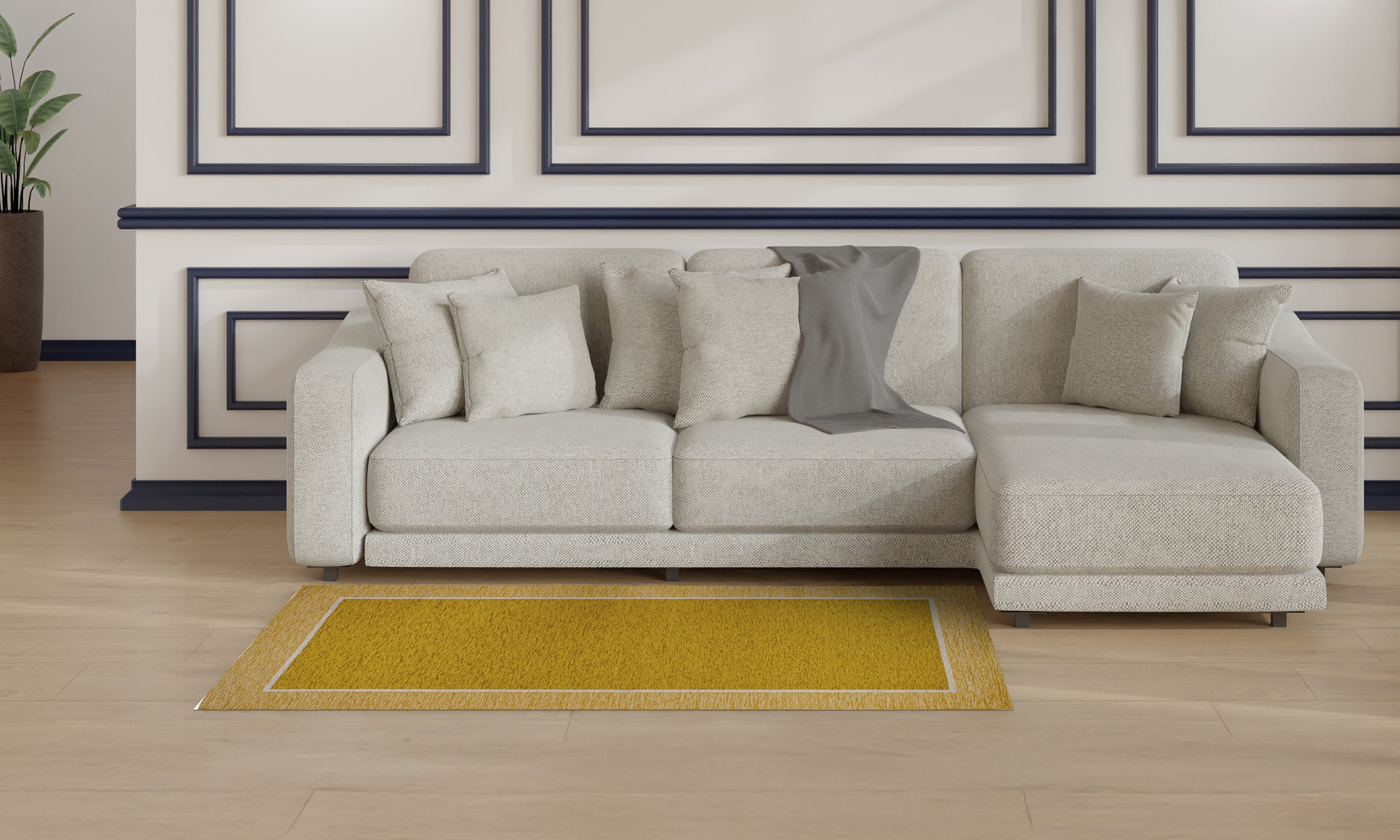 Modern yellow rug in front of a light gray sectional sofa in a stylish living room setting.