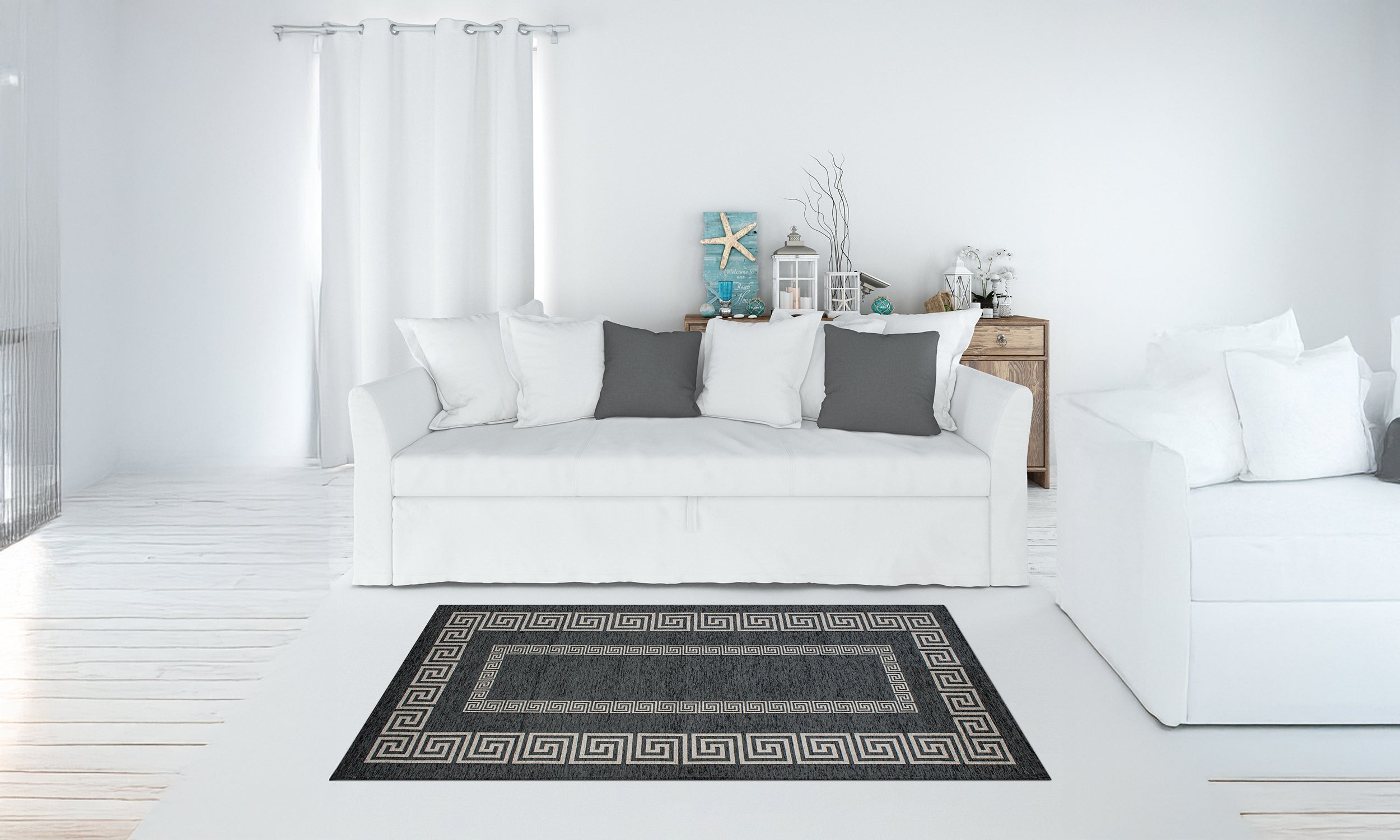 Modern black and grey rug in living room setting with white sofa and decorative pillows, featuring an anti-slip design.